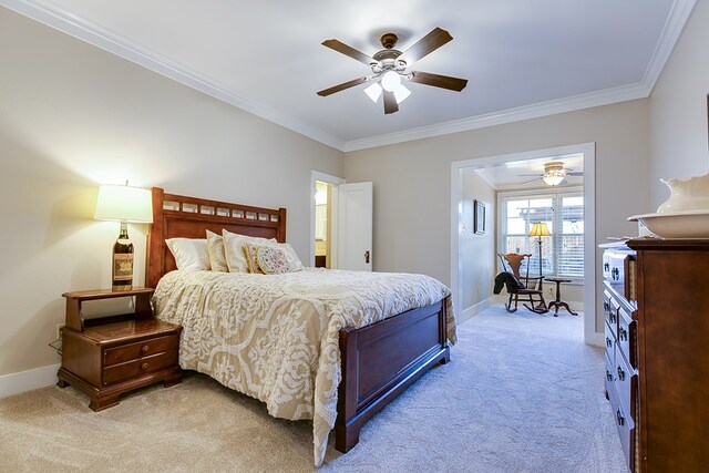 bedroom featuring crown molding, ceiling fan, and light carpet