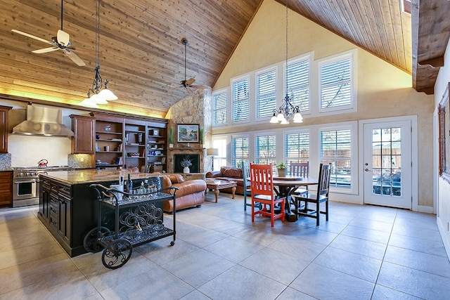 interior space with ceiling fan with notable chandelier, high vaulted ceiling, and wooden ceiling