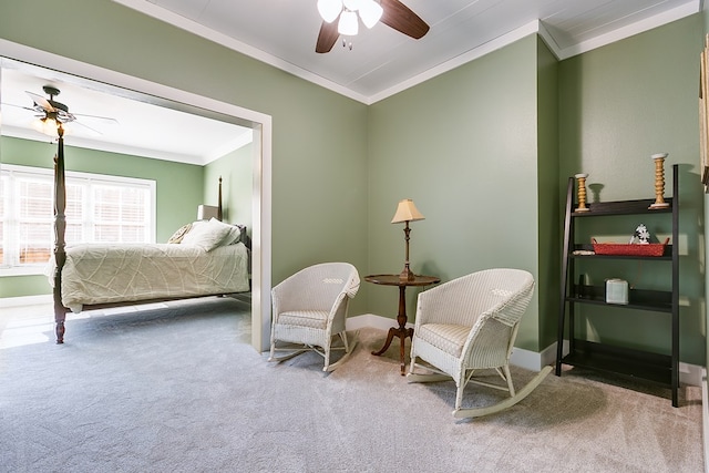 sitting room featuring crown molding, carpet, and ceiling fan