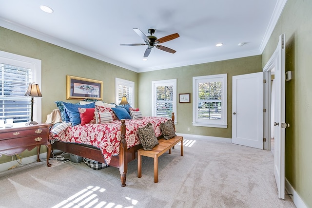 bedroom with light carpet, ornamental molding, and ceiling fan