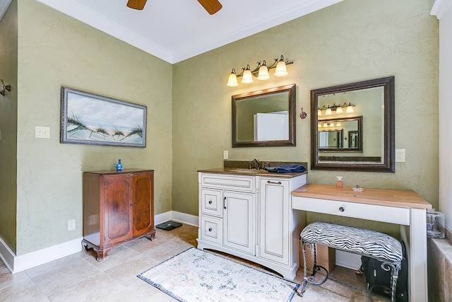 bathroom with vanity, ceiling fan, and crown molding