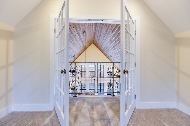 stairs with vaulted ceiling, carpet flooring, and french doors