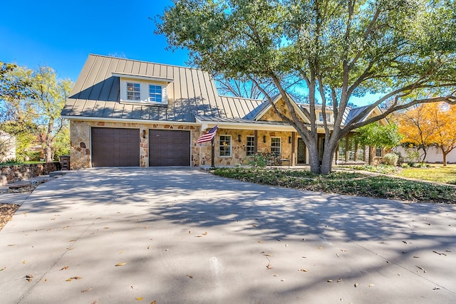 view of front of house with a garage and covered porch