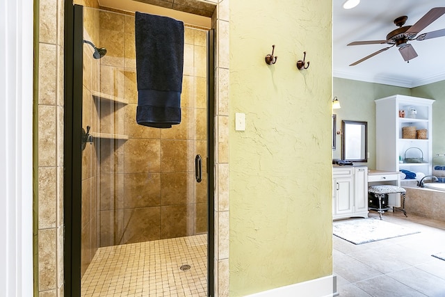 bathroom with vanity, crown molding, a shower with door, and ceiling fan