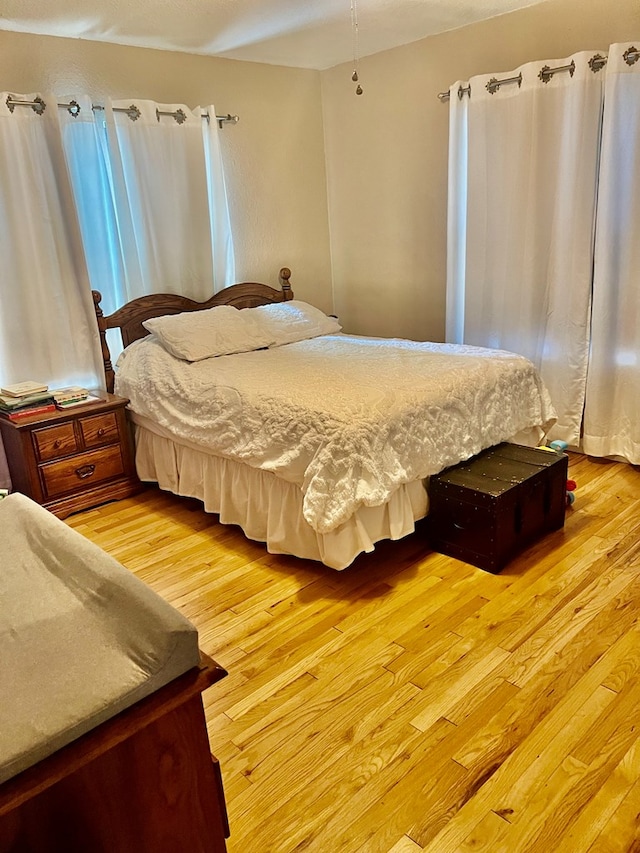 bedroom with light hardwood / wood-style floors