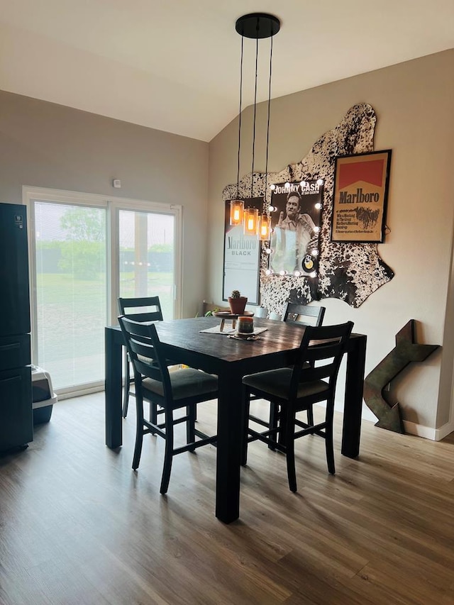 dining area with wood finished floors