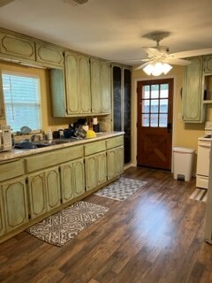 2026 Mermaid Rd, San Angelo, TX 76904 - kitchen featuring dark wood-type flooring, ceiling fan, light countertops, and range