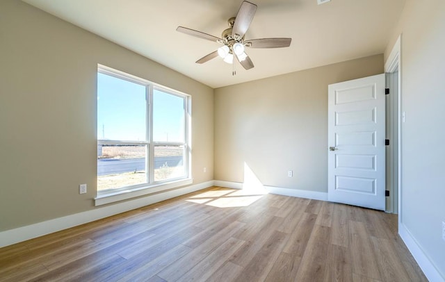 unfurnished room featuring ceiling fan and light hardwood / wood-style flooring