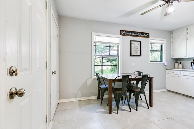 1632 Mission Ave, San Angelo, TX 76905 - dining space with healthy amount of natural light, ceiling fan, baseboards, and light tile patterned floors