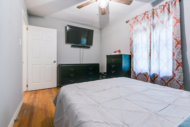 1632 Mission Ave, San Angelo, TX 76905 - bedroom with hardwood / wood-style floors, baseboards, and a ceiling fan