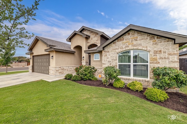 5949 Merrick St, San Angelo, TX 76904 - french country style house featuring stone siding, a front yard, driveway, stucco siding, and an attached garage