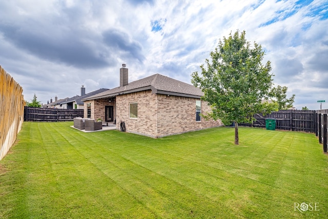 5949 Merrick St, San Angelo, TX 76904 - fenced backyard with outdoor lounge area and a patio