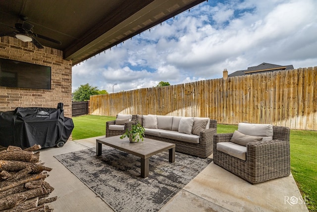 5949 Merrick St, San Angelo, TX 76904 - fenced backyard with ceiling fan, area for grilling, a patio, and an outdoor hangout area