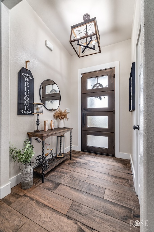 5949 Merrick St, San Angelo, TX 76904 - foyer entrance featuring wood-type flooring and a chandelier