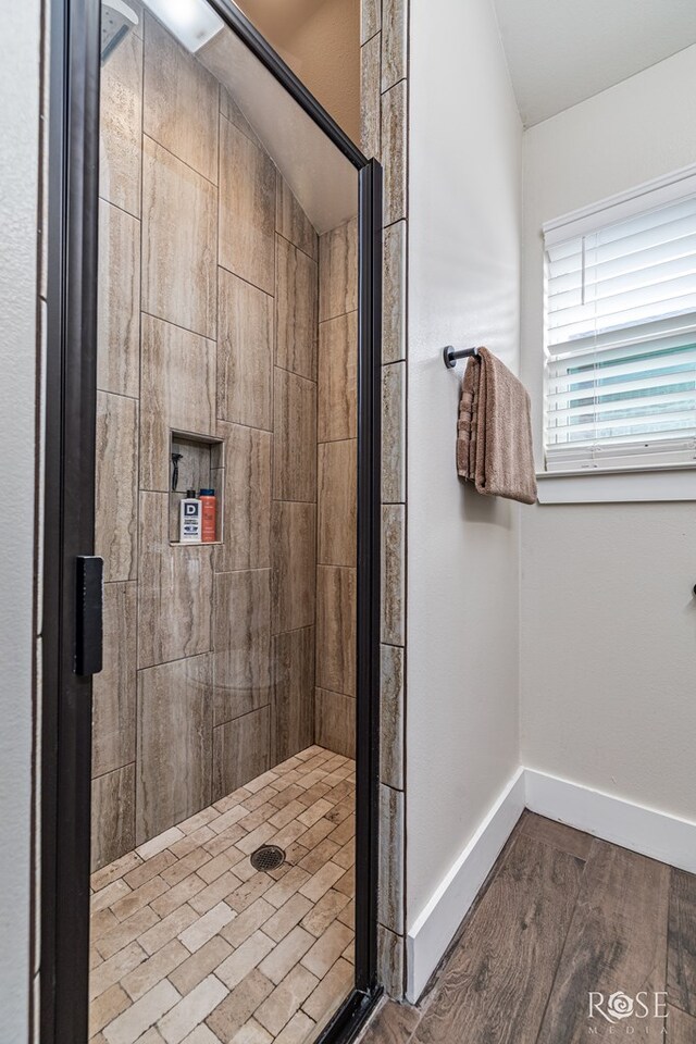 5949 Merrick St, San Angelo, TX 76904 - full bathroom featuring a shower stall and wood finished floors