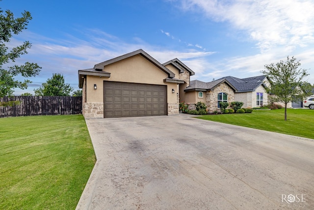 5949 Merrick St, San Angelo, TX 76904 - view of front of property with stone siding, an attached garage, driveway, and stucco siding