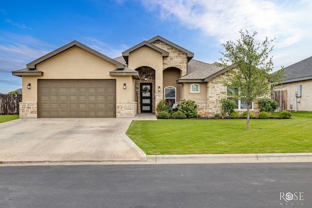 5949 Merrick St, San Angelo, TX 76904 - view of front of home featuring stone siding, stucco siding, and a garage