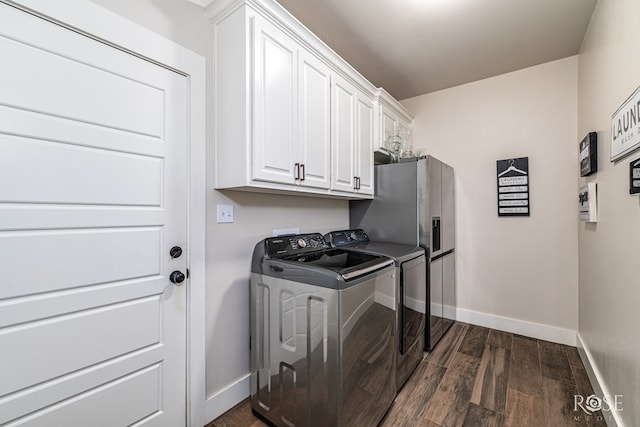 5949 Merrick St, San Angelo, TX 76904 - laundry room featuring washer and dryer, cabinet space, and dark wood-type flooring