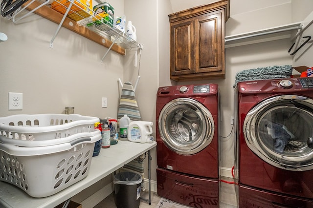 laundry room with cabinet space and washer and dryer