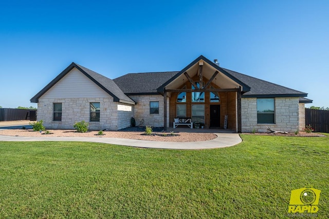 3536 Jaguar Trl, San Angelo, TX 76901 - view of front facade with stone siding and roof with shingles