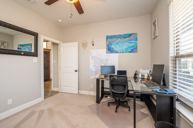 home office with ceiling fan, carpet, and baseboards