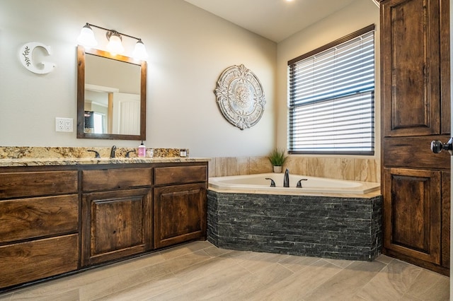 bathroom featuring a bath and vanity