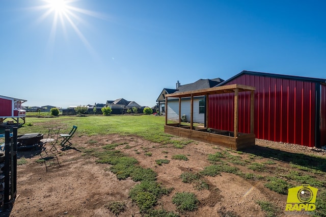 3536 Jaguar Trl, San Angelo, TX 76901 - view of green lawn featuring a garden and an outdoor structure