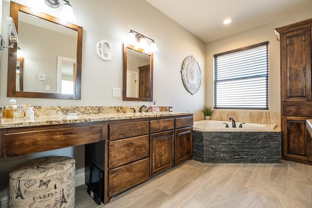 full bath with a garden tub and vanity