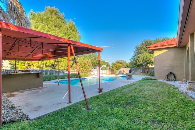 view of pool with a lawn