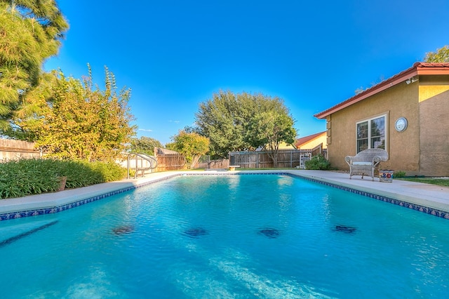 view of swimming pool with a patio area