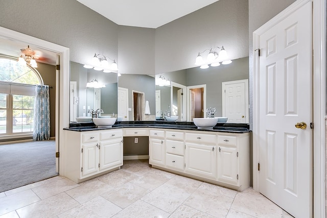 bathroom featuring tile patterned flooring and vanity