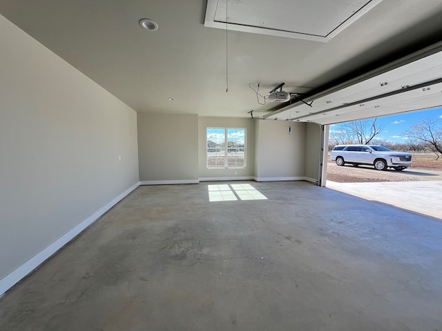 garage featuring baseboards and a garage door opener