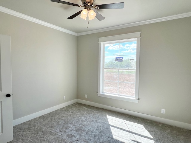 empty room featuring ornamental molding, light carpet, plenty of natural light, and baseboards