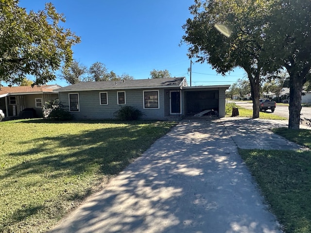 ranch-style home with a front yard