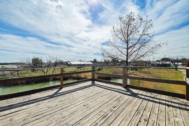 deck featuring a water view