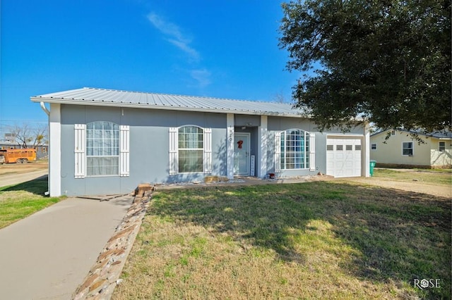 ranch-style house with a garage and a front yard