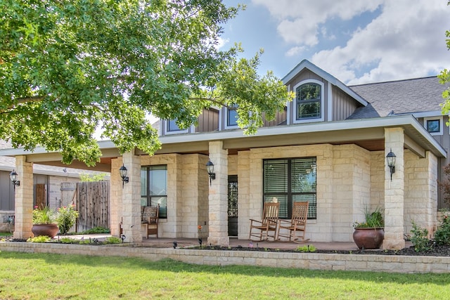 2030 Silver Creek Ct, San Angelo, TX 76904 - view of front facade featuring stone siding, covered porch, board and batten siding, and a shingled roof