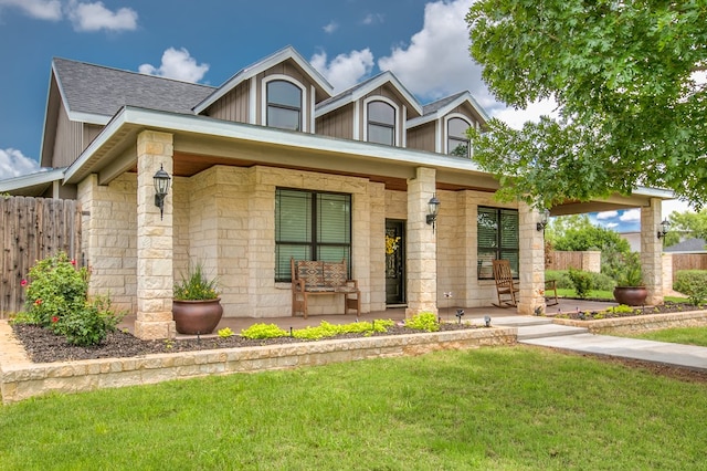2030 Silver Creek Ct, San Angelo, TX 76904 - view of front of home with covered porch, stone siding, and roof with shingles