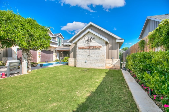 2030 Silver Creek Ct, San Angelo, TX 76904 - view of front of property with board and batten siding and stone siding