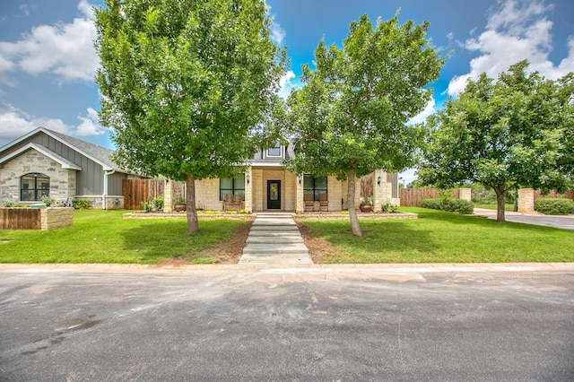 2030 Silver Creek Ct, San Angelo, TX 76904 - obstructed view of property featuring stone siding, board and batten siding, and a porch