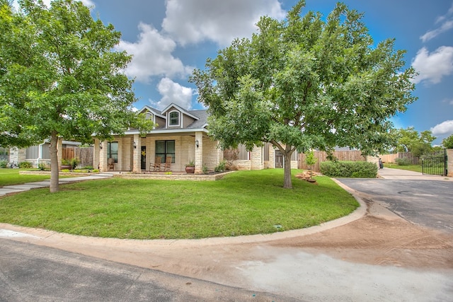 2030 Silver Creek Ct, San Angelo, TX 76904 - obstructed view of property featuring stone siding and a porch