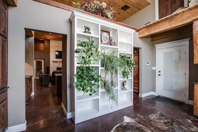 2030 Silver Creek Ct, San Angelo, TX 76904 - foyer with concrete floors, baseboards, and wooden ceiling