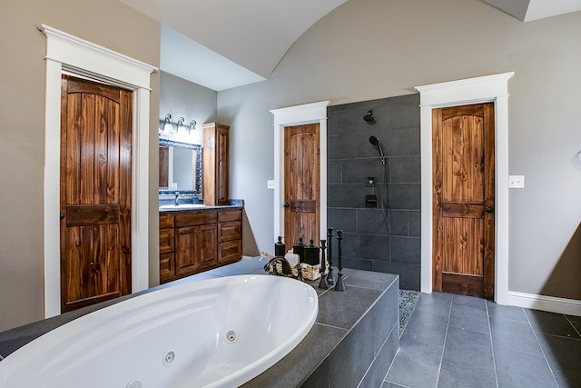 2030 Silver Creek Ct, San Angelo, TX 76904 - full bathroom featuring a whirlpool tub, a tile shower, vanity, tile patterned flooring, and lofted ceiling