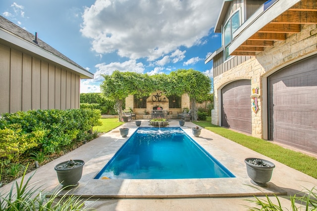 2030 Silver Creek Ct, San Angelo, TX 76904 - outdoor pool with an outdoor stone fireplace and a patio