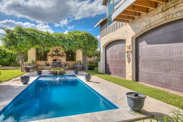 2030 Silver Creek Ct, San Angelo, TX 76904 - view of pool with an outdoor stone fireplace and a patio area