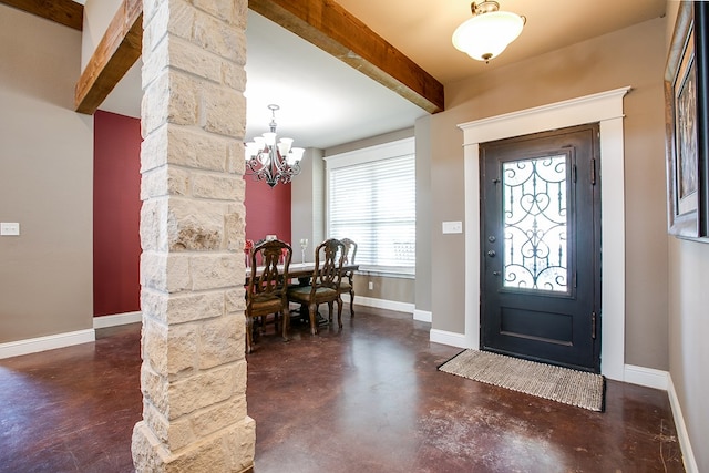 2030 Silver Creek Ct, San Angelo, TX 76904 - foyer featuring finished concrete flooring, baseboards, beam ceiling, and a chandelier