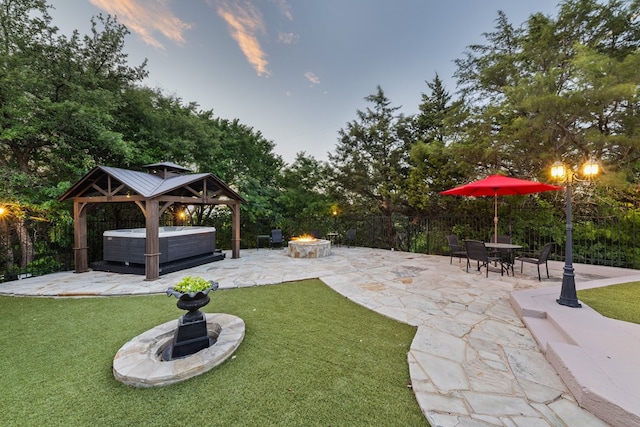 2721 Old Decatur Rd, Decatur, TX 76234 - view of yard with a hot tub, an outdoor fire pit, a patio area, and a gazebo