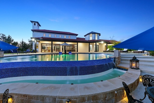 2721 Old Decatur Rd, Decatur, TX 76234 - pool at dusk with an infinity pool and a patio area
