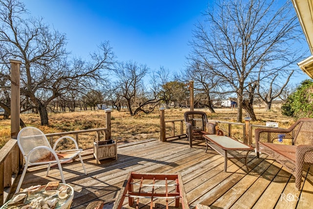 wooden terrace with a rural view