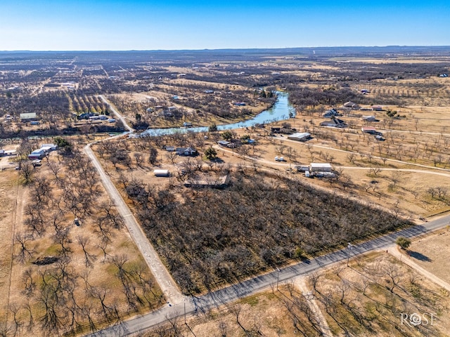 aerial view with a rural view and a water view